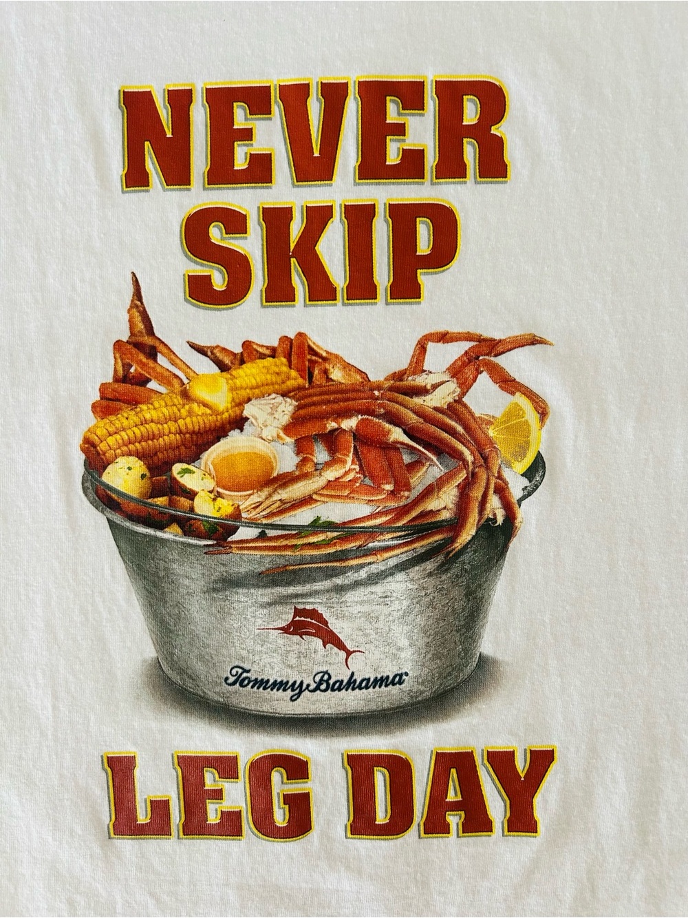 Tommy Bahama White T-shirt Graphic Crab Legs Leg Day with Red and Yellow Text